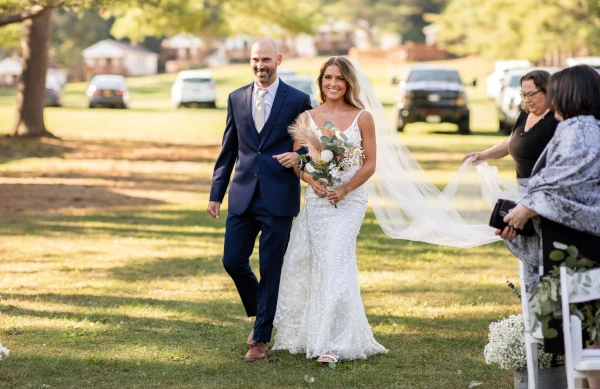 Dr. Vin having the honor of walking Coach Kayla down the aisle at her wedding